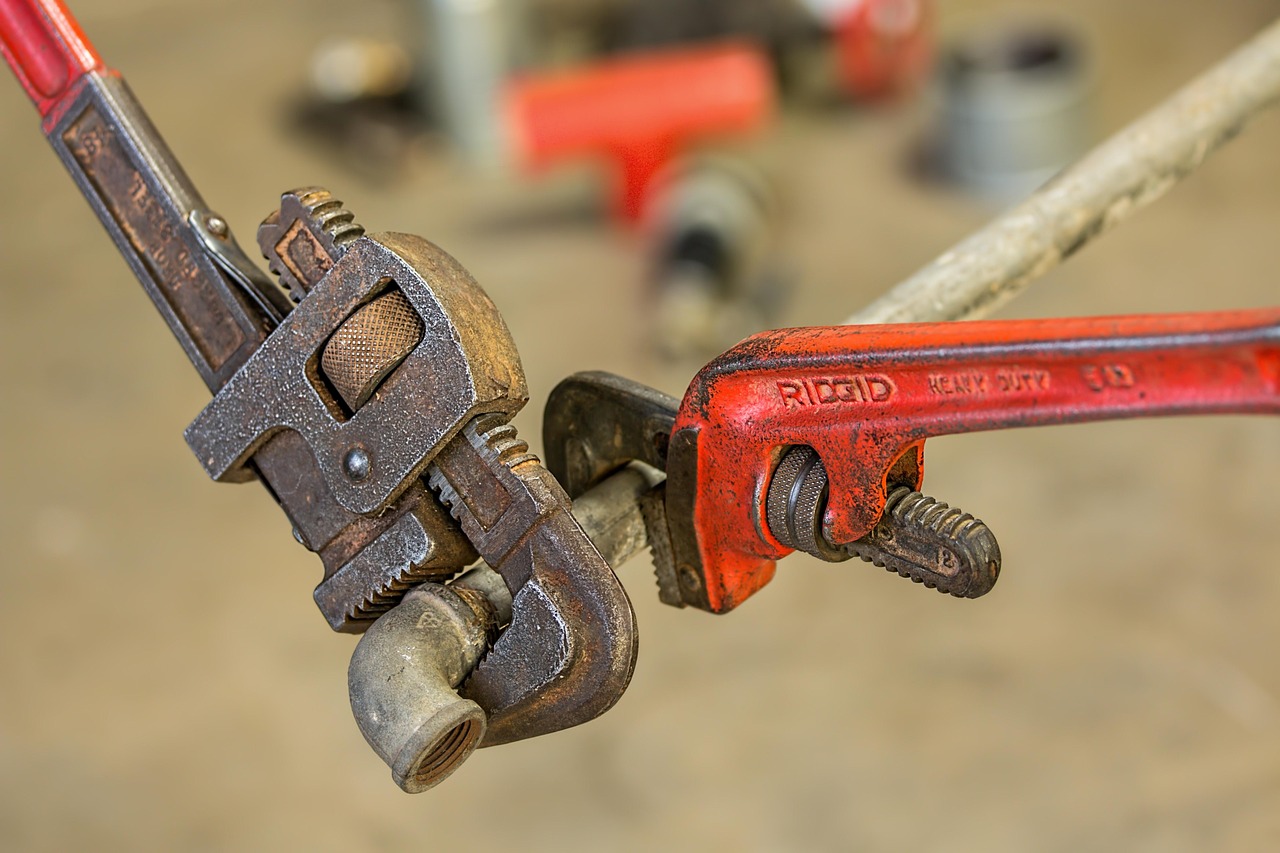 Pipe wrench and plumbing repair tools